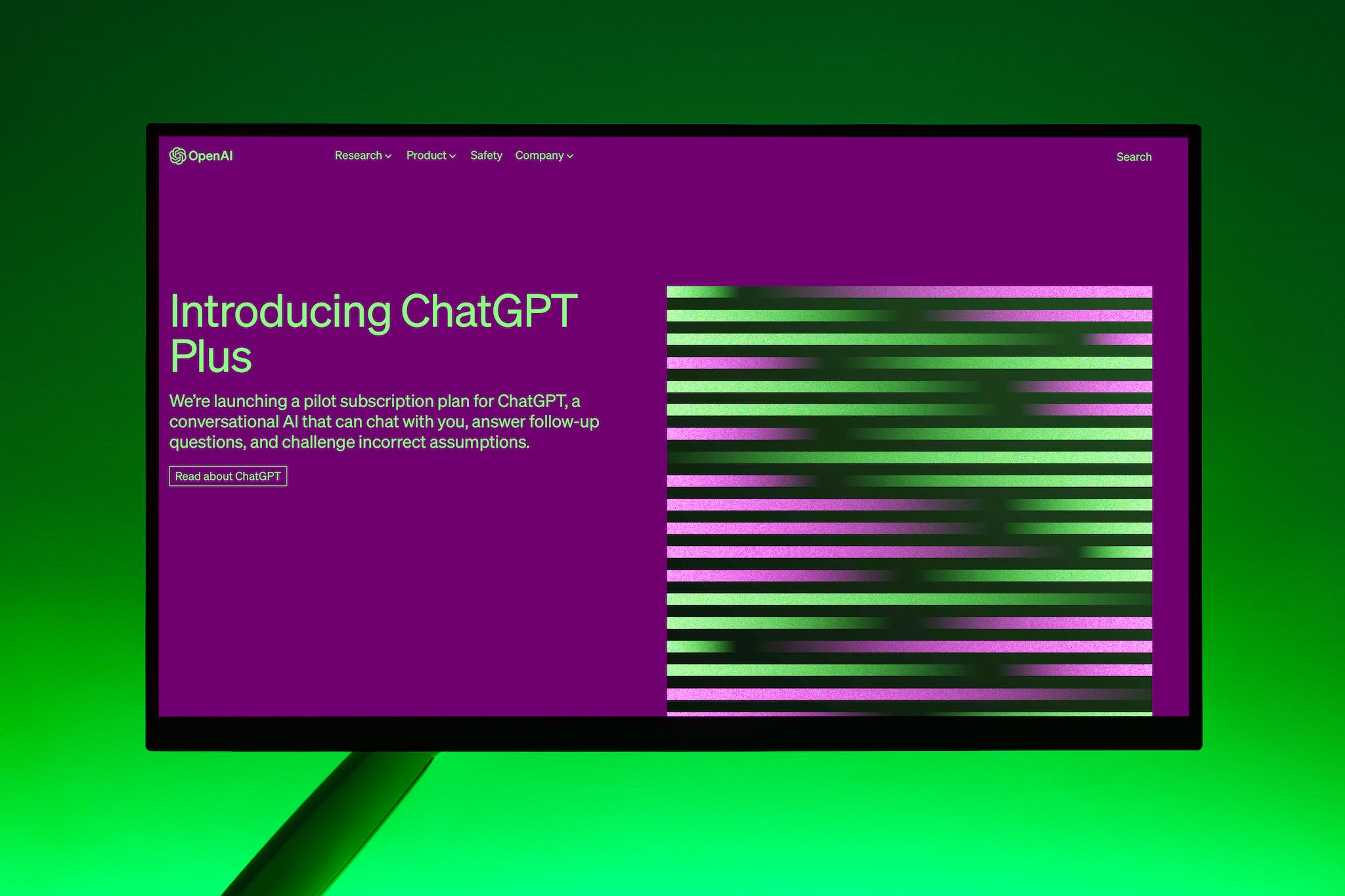 Monitor screen showing ChatGPT Plus landing page